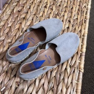 Grey slip on shoes.
